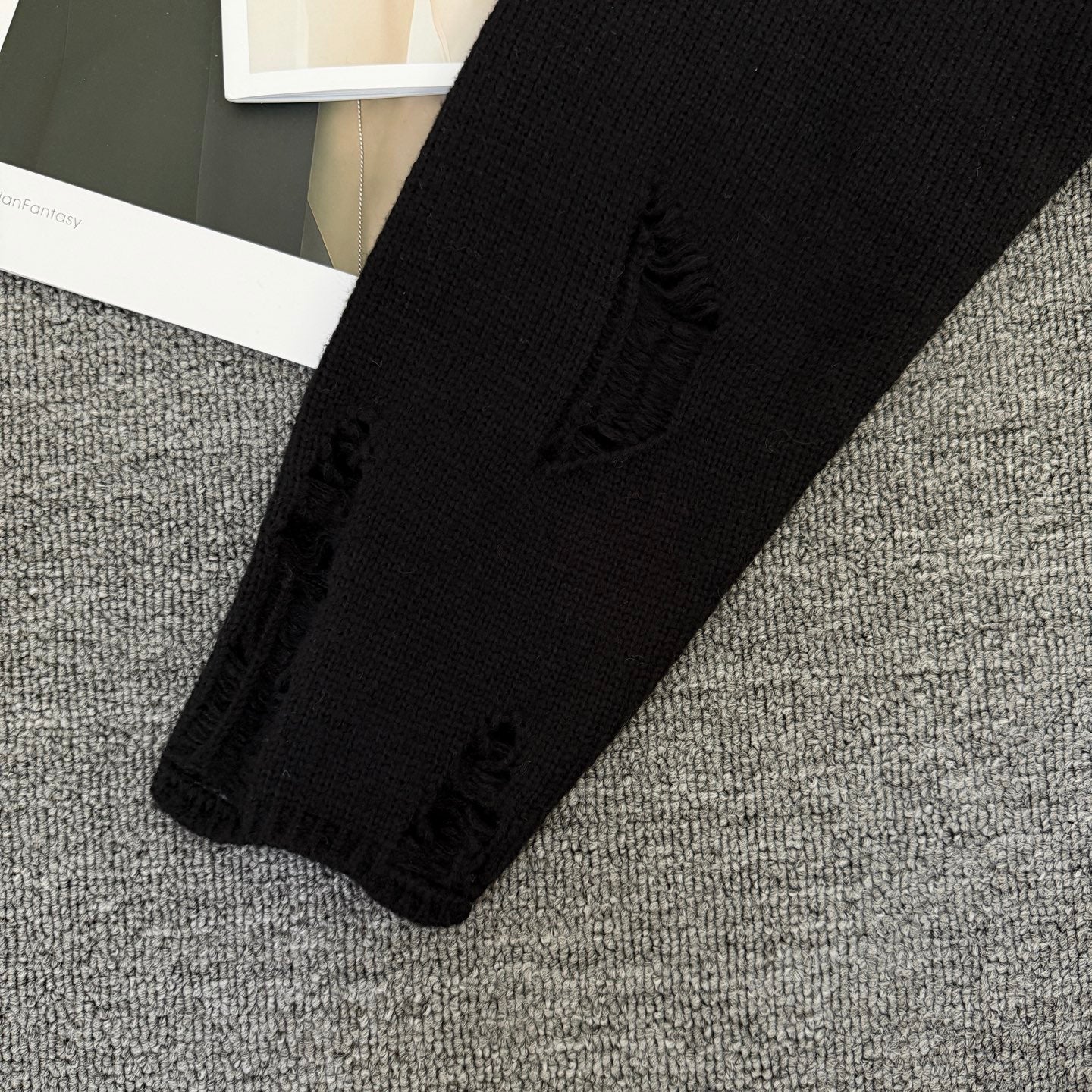 Long-sleeve sweater with decorative knit detail on sleeve cuff