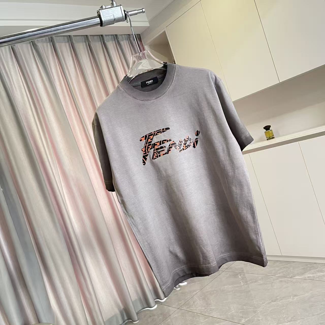 Fendi short-sleeve T-shirt, heather gray, chest logo graphic in orange and black