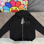 Black zip-up hoodie with hood, silver zipper, and front charm pendant detail
