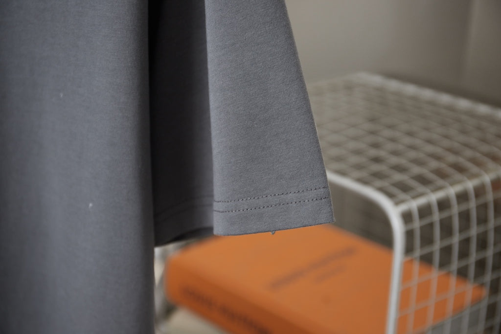 Louis Vuitton dark gray T-shirt with visible hem stitching and orange inner label