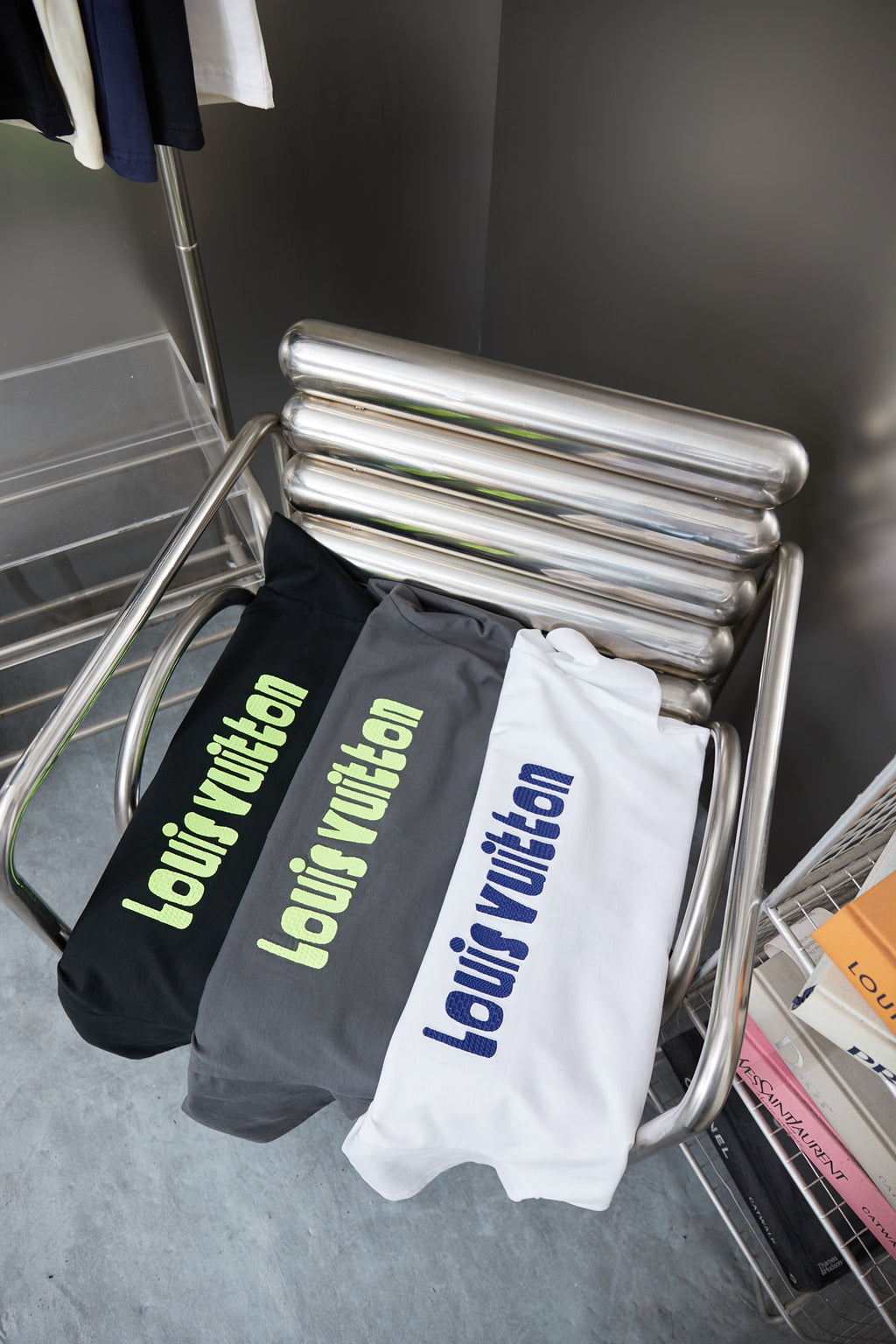Louis Vuitton dark gray and white T-shirts with lime 'Louis Vuitton' logos on rack