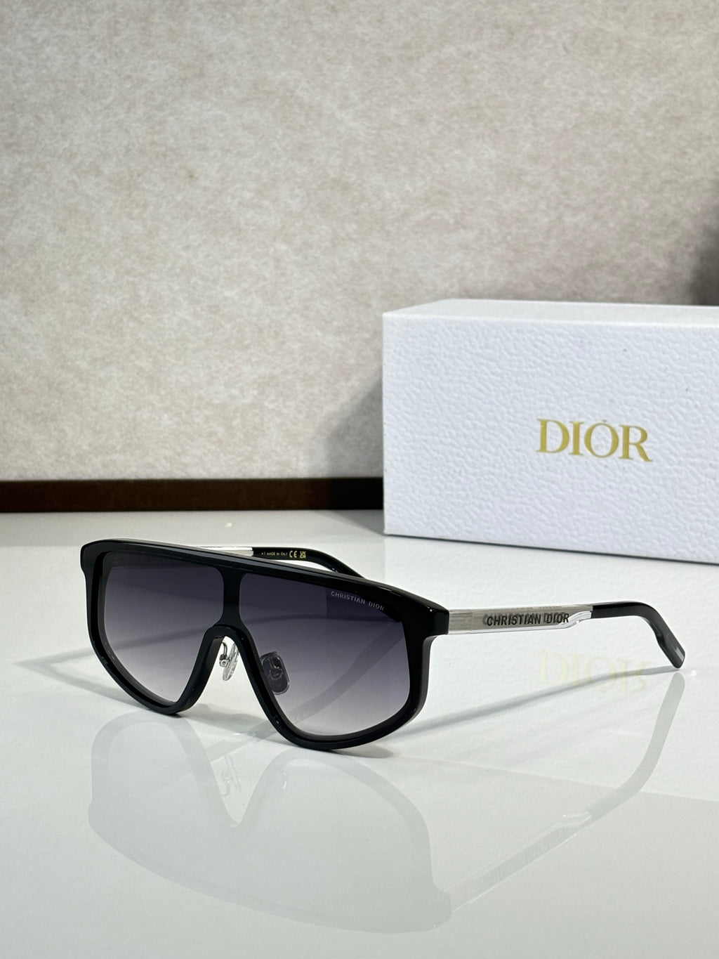 Dior sunglasses with black frame and dark gradient tinted lenses
