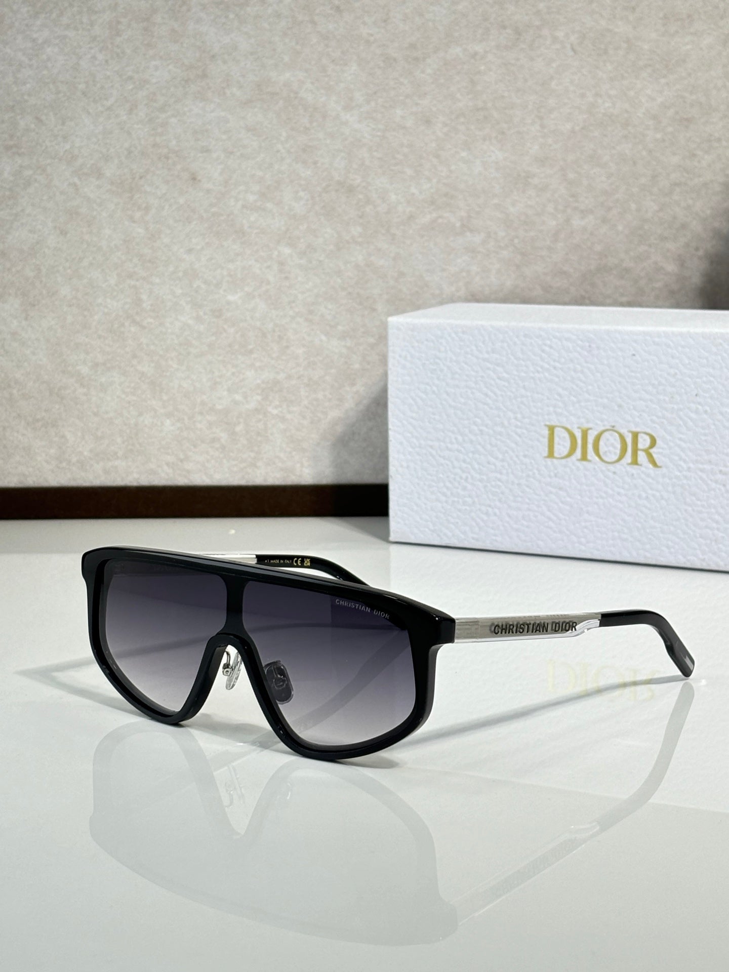 Dior sunglasses with black frame and dark gradient tinted lenses