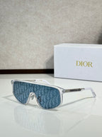 Dior sunglasses with clear frame and blue patterned tinted lenses
