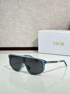 Dior sunglasses with gunmetal frame and blue-tinted lenses