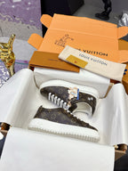 Louis Vuitton monogram sneakers with white laces, low-top.