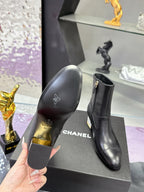 Black leather boot sole and side view with CHANEL logo on heel