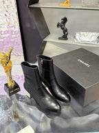 Black leather ankle boots with block heel, side logo, pull-on style