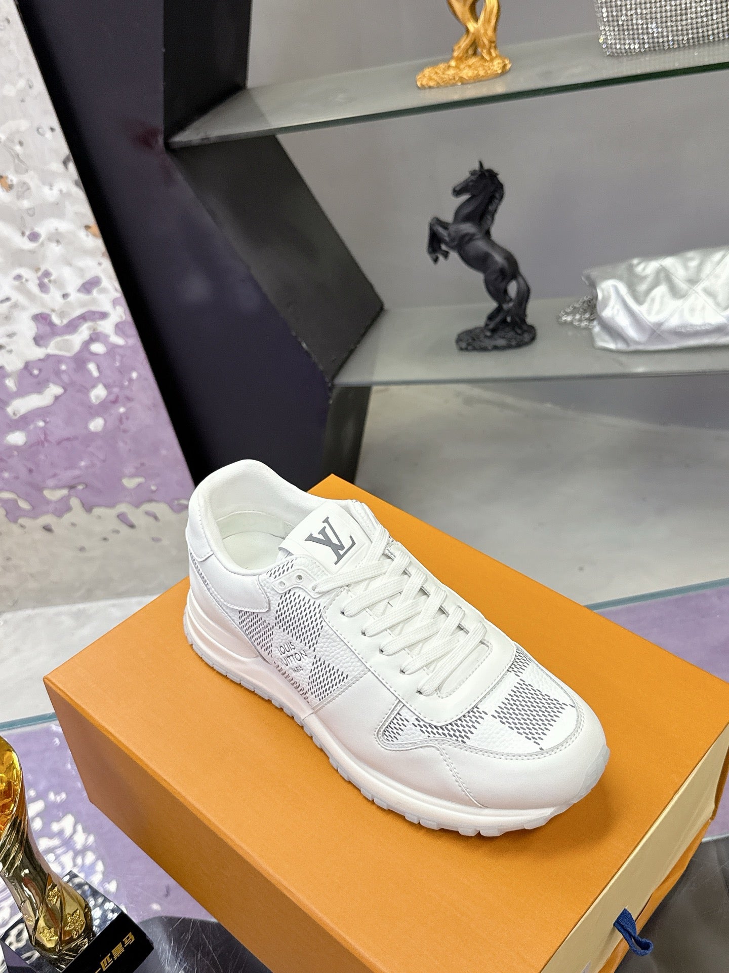 Louis Vuitton white lace-up sneaker with Damier-style logo print and chunky sole