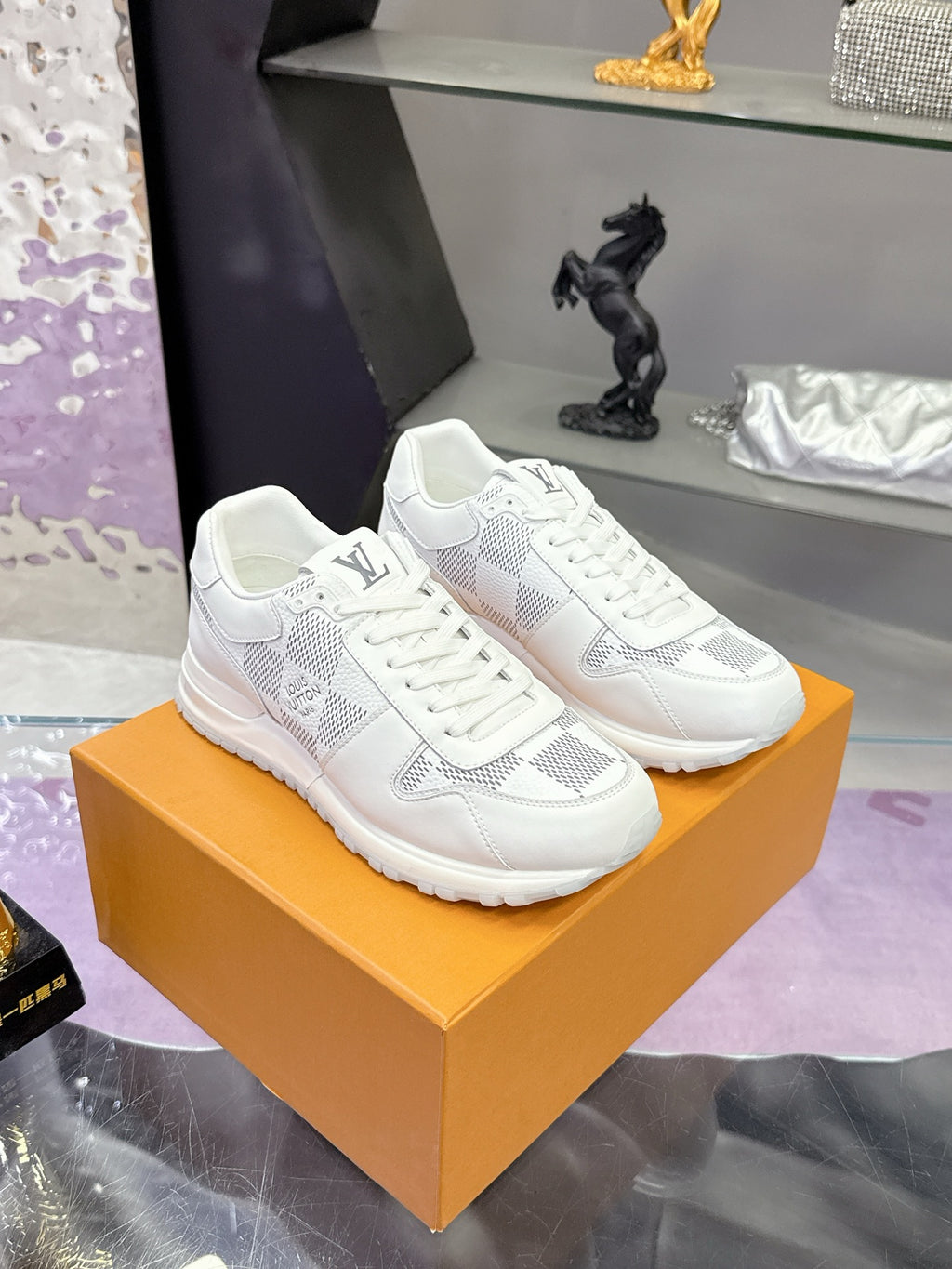 Louis Vuitton white lace-up sneakers with Damier-style logo print, front view