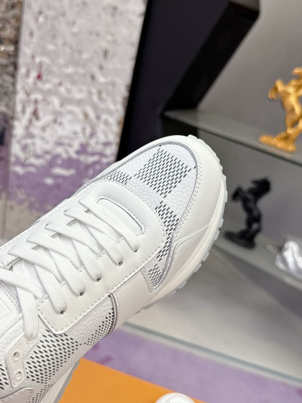 Louis Vuitton white sneaker upper with perforated Damier-style logo panel and laces