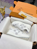 Louis Vuitton white lace-up sneakers with Damier-style logo print and chunky sole