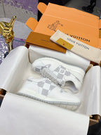Louis Vuitton white lace-up sneakers with Damier-style logo print and chunky sole