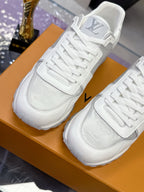 Louis Vuitton ladies white sneakers with LV logo on heel and side, lace-up design