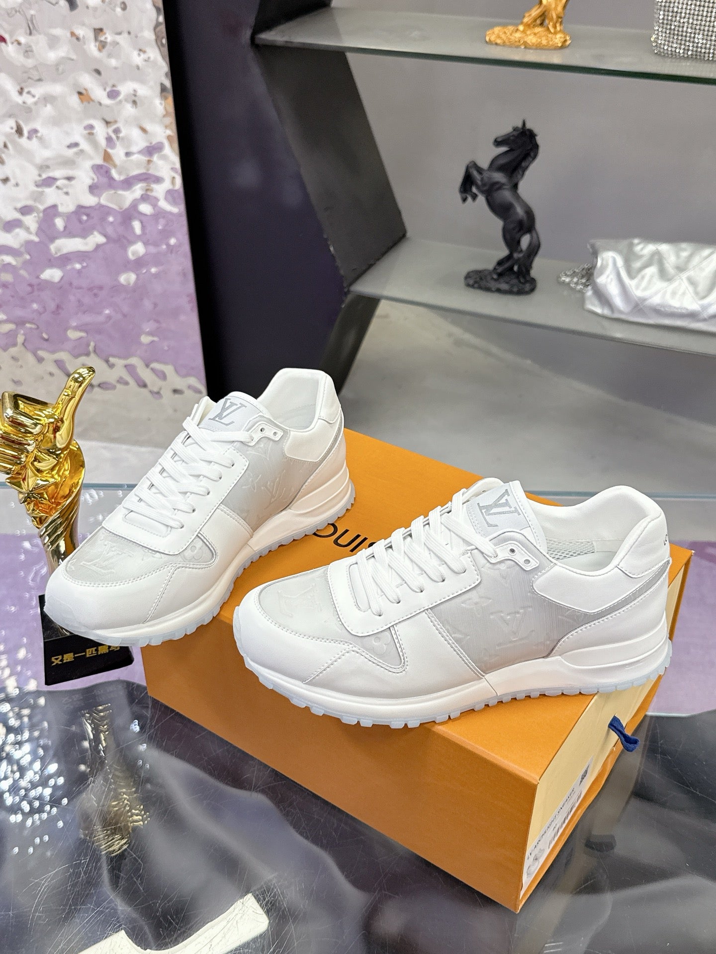 Louis Vuitton ladies white sneakers, lace-up with embossed side logo and rubber sole
