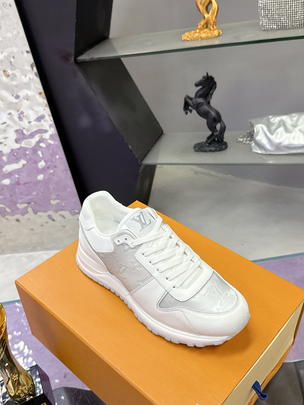 Louis Vuitton ladies white lace-up sneakers on orange box, low-profile rubber sole