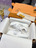 Louis Vuitton ladies white leather sneakers with lace-up front and rubber sole
