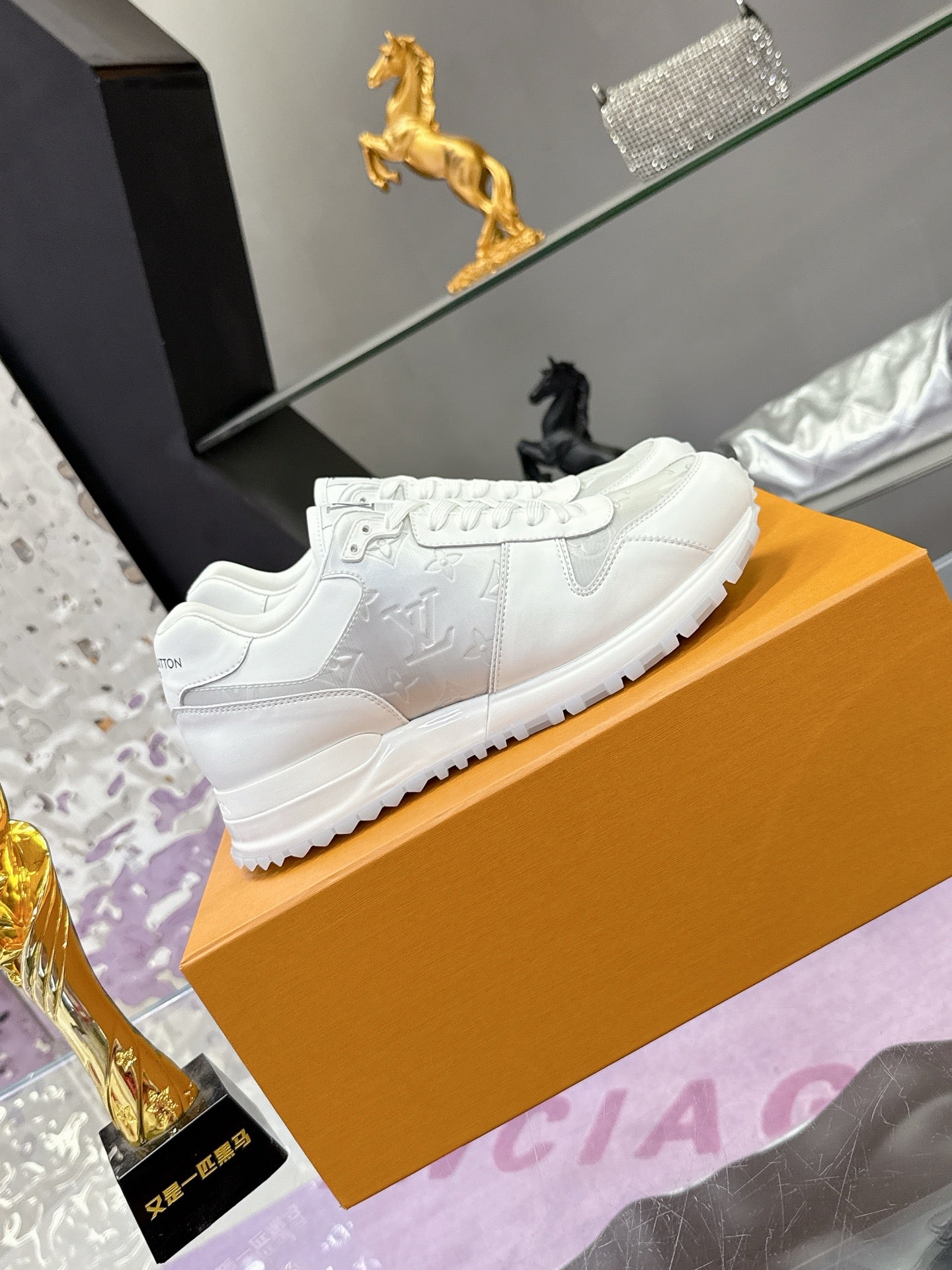 Louis Vuitton ladies white lace-up sneakers with textured stitching and thick sole
