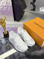 Louis Vuitton ladies white leather sneakers, lace-up with embossed LV logo detail