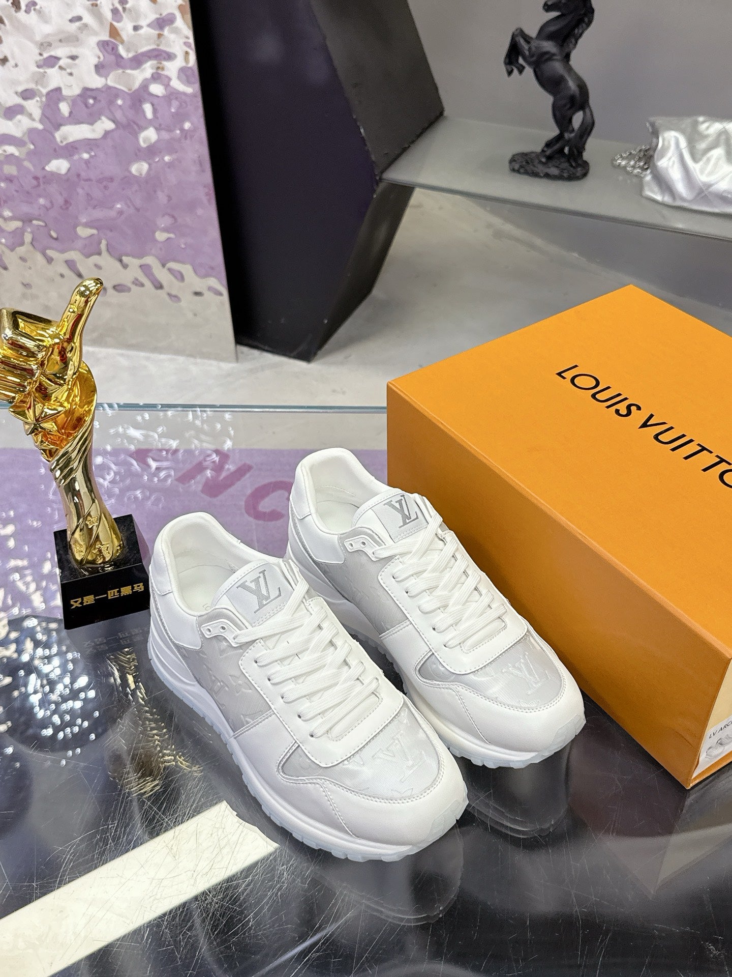 Louis Vuitton ladies white leather sneakers, lace-up with embossed LV logo detail