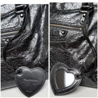 Balenciaga black heart leather bag charm with lace cord and stitched edge detail