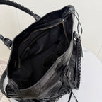 Balenciaga black leather tote bag open top with black lining and dual zipper pulls