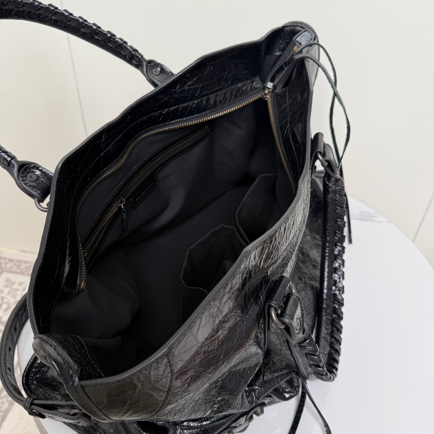 Balenciaga black leather tote bag open top with black lining and dual zipper pulls