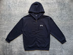 Stussy navy zip-up hoodie with drawstring hood and small chest logo