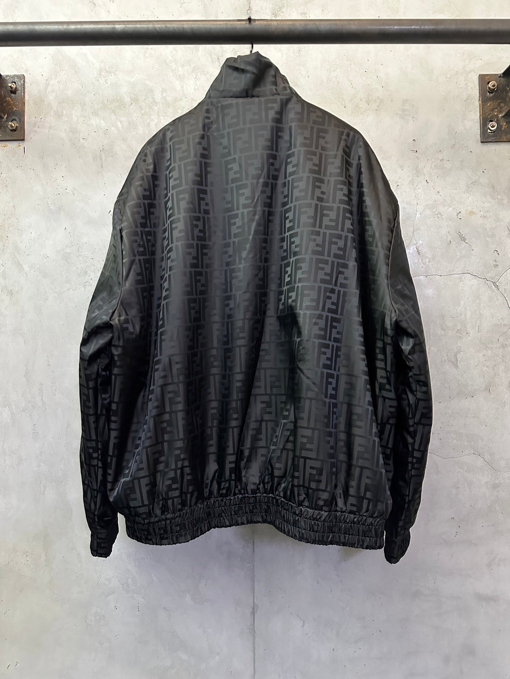 Black long-sleeve jacket back view with full-zip front and ribbed hem, FENDI pattern