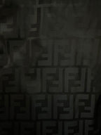 Black jacquard fabric with repeating FENDI monogram pattern