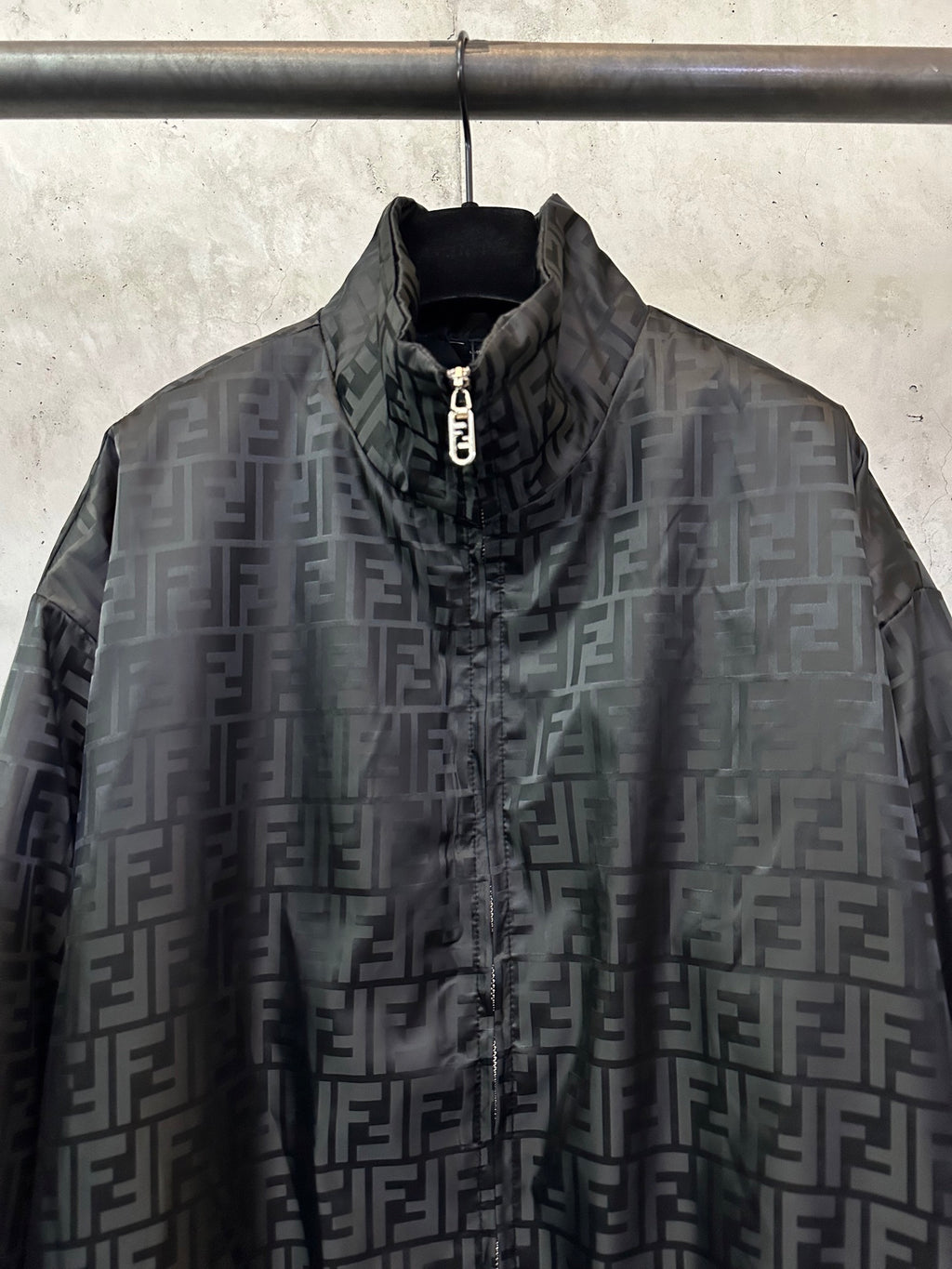 Black long-sleeve jacket with high collar and metal zip pull, FENDI jacquard pattern