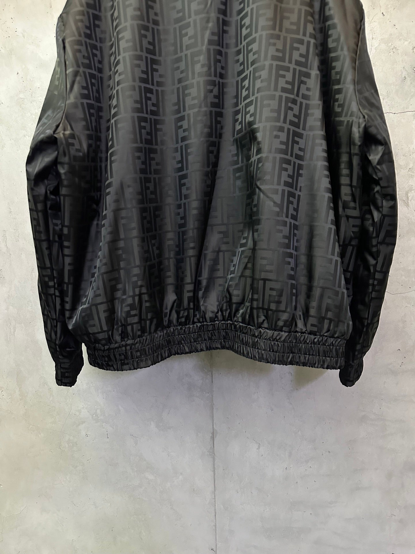 Black long-sleeve jacket back with ribbed hem and allover FENDI pattern
