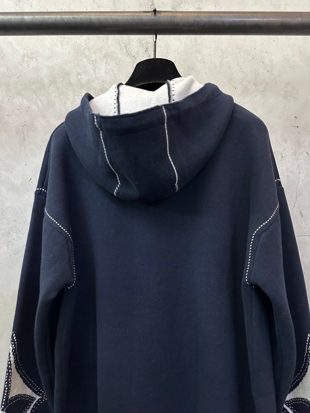 Navy Louis Vuitton zip-up hoodie hood with inner white lining and side graphics
