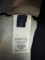 Clothing care label inside Louis Vuitton hoodie: made in Italy, wash instructions