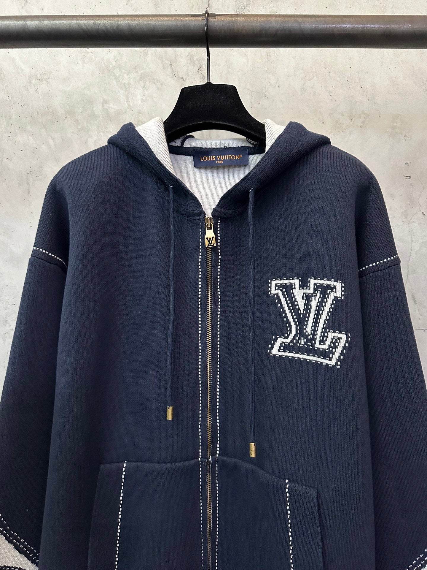 Navy Louis Vuitton zip-up hoodie with hood, LV logo patch, and dotted trim