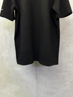 Amiri T-shirt, black short-sleeve with curved hem, no visible front graphic