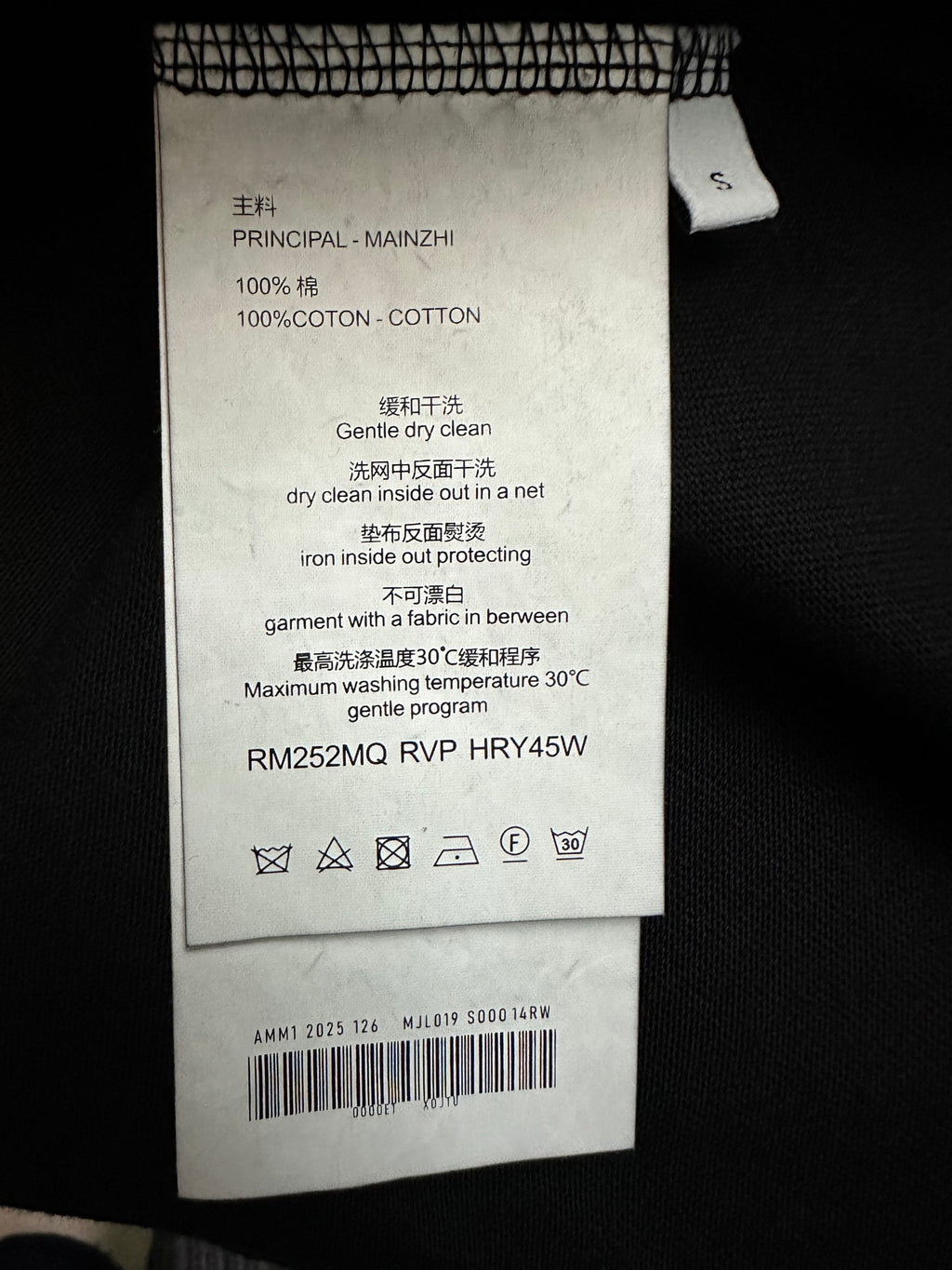Amiri T-shirt care label, 100% cotton, dry clean inside net