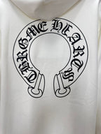 White hoodie close-up of large circular logo graphic on the front
