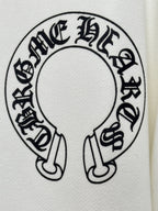 White hoodie fabric close-up of large circular graphic logo in black