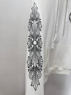 White hoodie sleeve with vertical fleur de lis line-art print