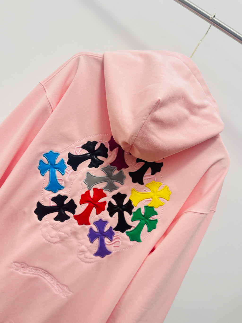 Pink hoodie with hood and large multicolor floral embroidery on the back