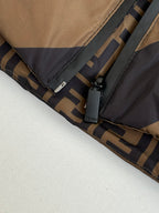 Fendi padded jacket hem with branded label and zipper area close-up