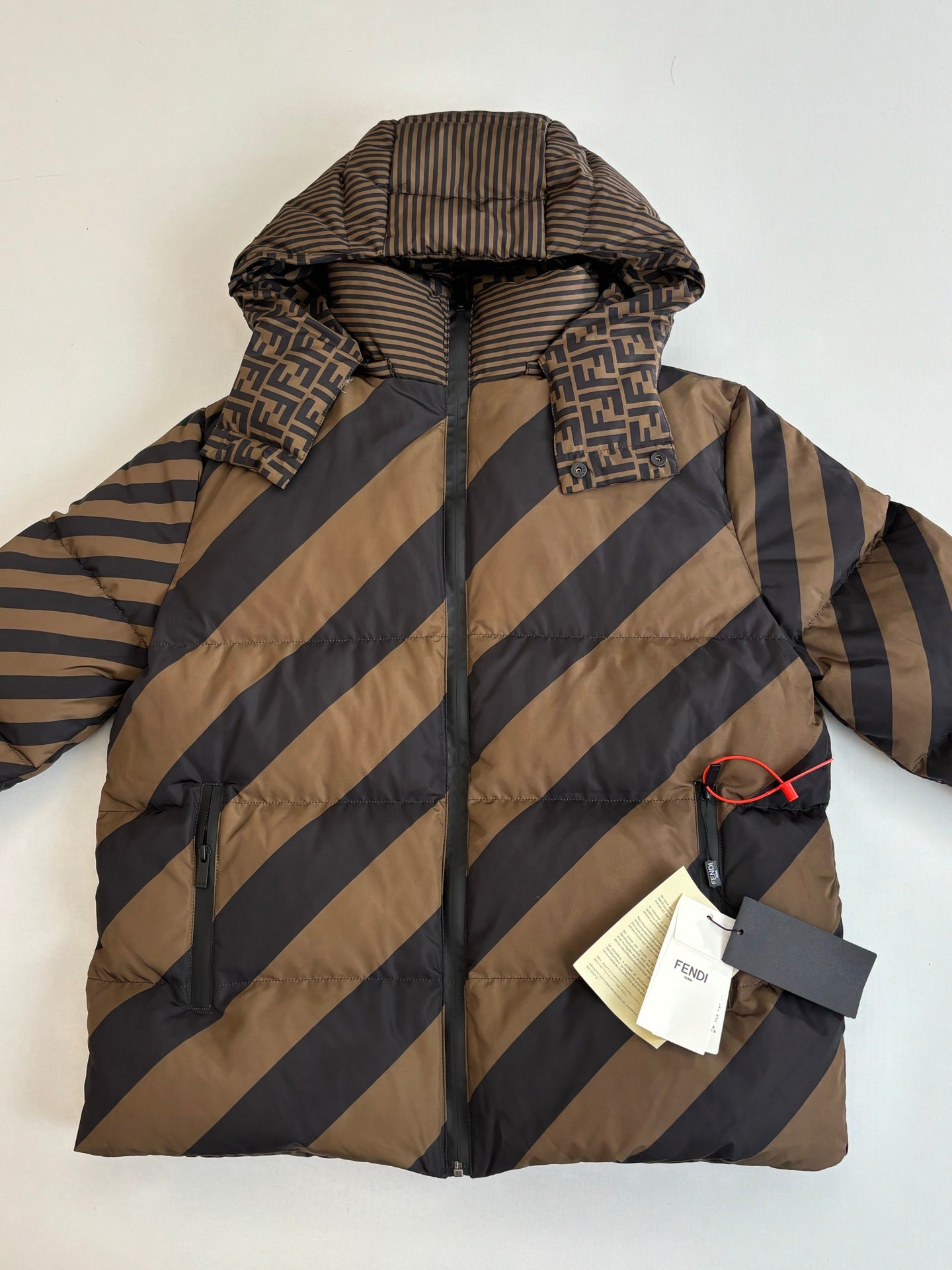 Fendi long hooded puffer jacket, diagonal stripes, snap front, tag attached