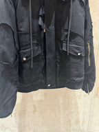 Balenciaga long jacket detail, dark with flap chest pockets and zipper trim