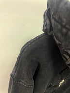 Dark long-sleeve hooded top with textured fabric