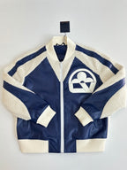Colorblock zip-up jacket with sherpa collar and cream side stripes on navy
