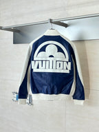 Colorblock sherpa jacket with back zip and large cream graphic logo on navy