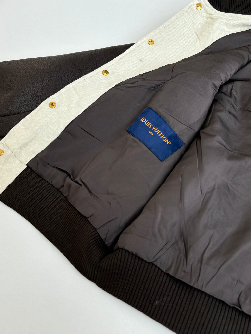 Louis Vuitton varsity jacket inner lining with gray panel and Louis Vuitton logo label