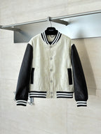 Louis Vuitton varsity jacket, cream body, black sleeves, striped ribbed collar and cuffs