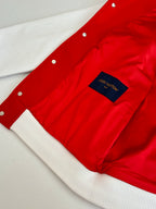 Red jacket interior lining with Louis Vuitton label and white ribbed trim